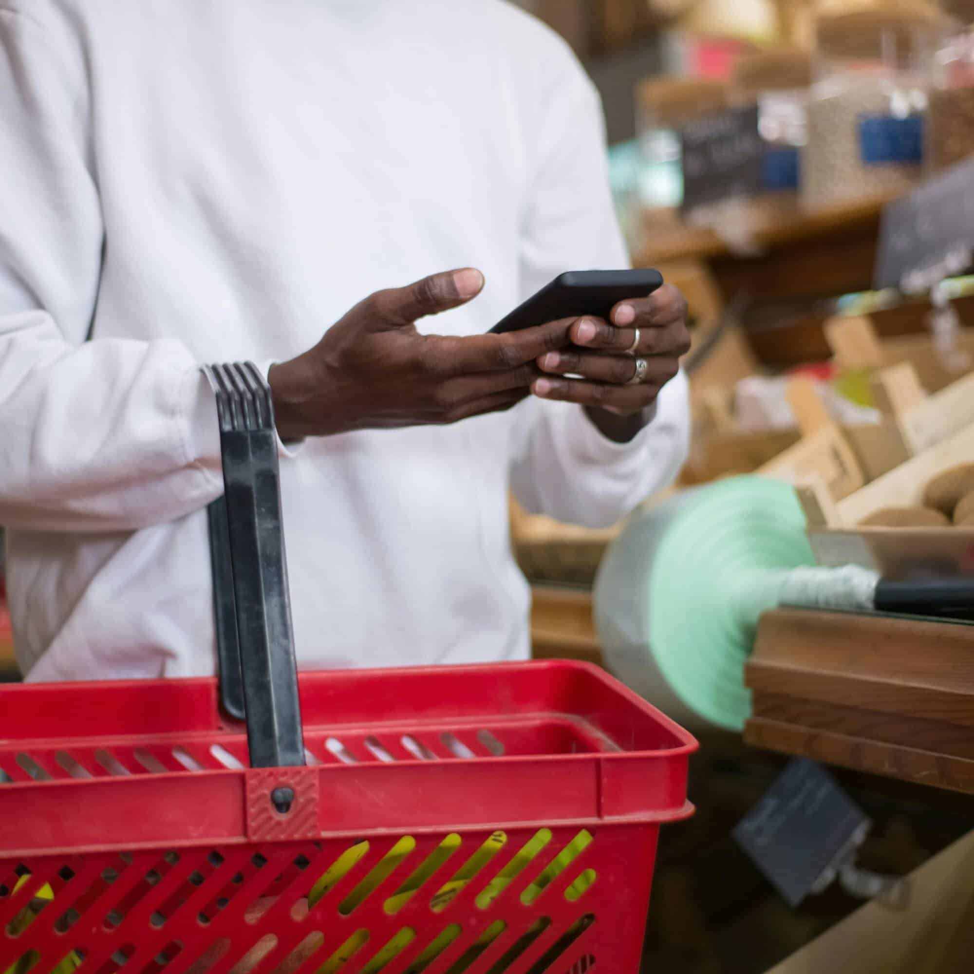 San Diego business owner using a smartphone to adapt to AI-powered search marketing