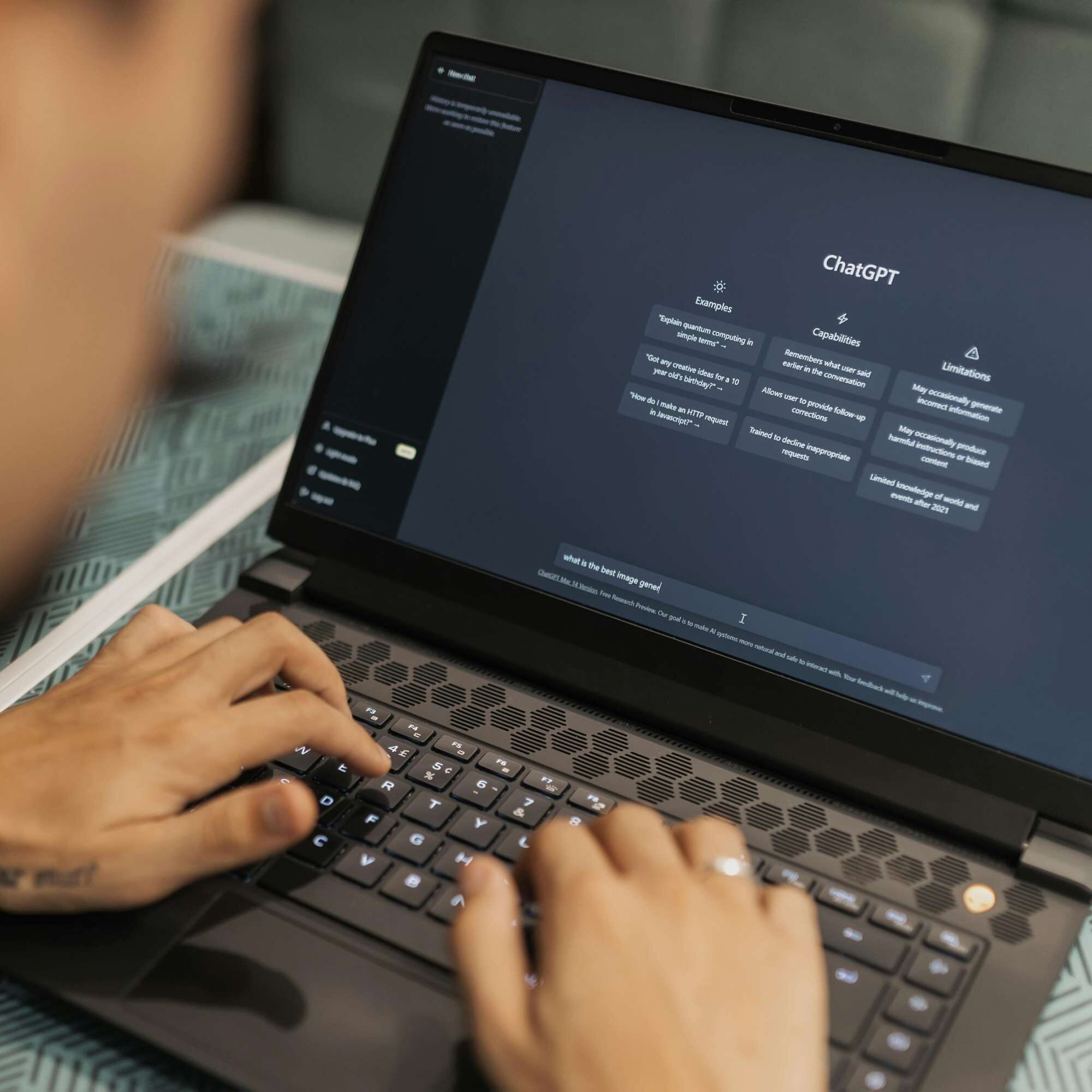 Digital marketer using a laptop to research generative engine optimization